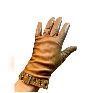 Beige Leather gloves by Nine West, lined. Grommet and buckle detail.EUC